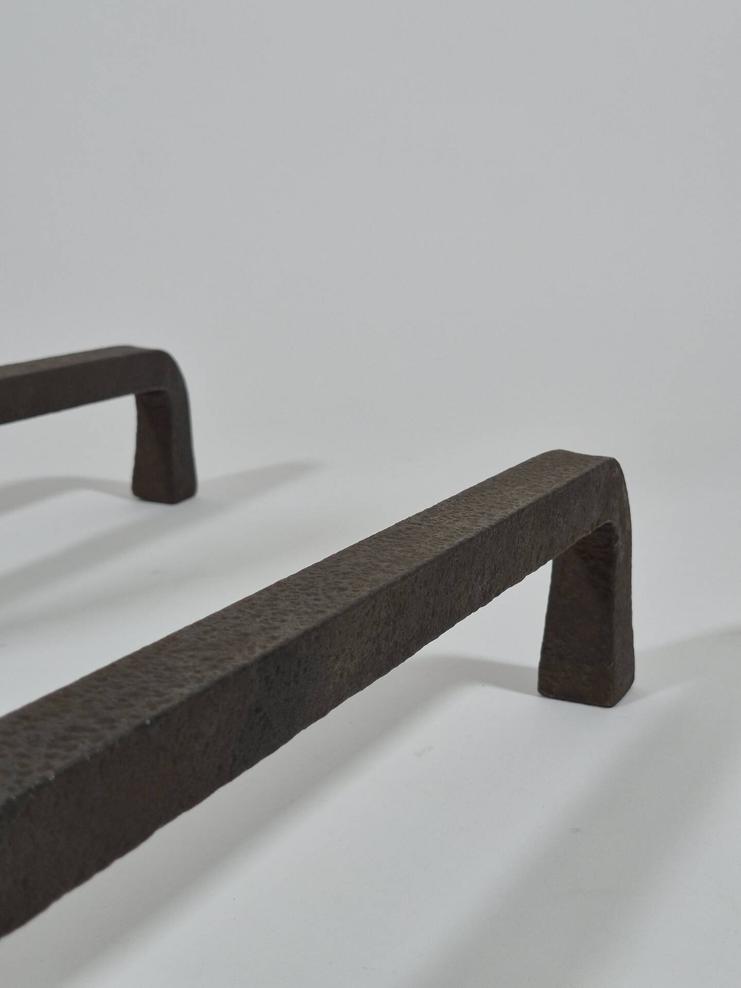 Pair of handforged metal and brass andirons