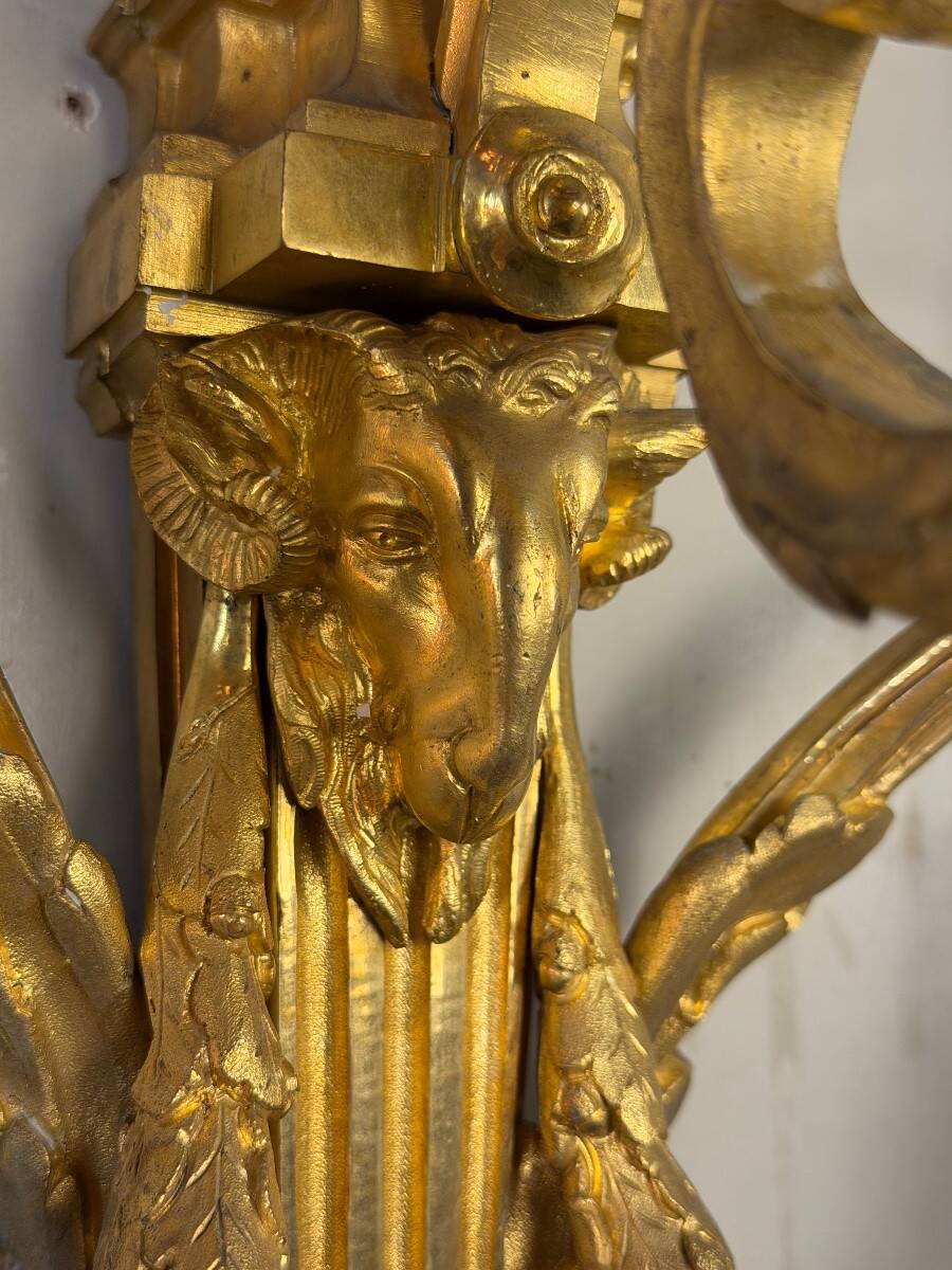 Pair of Louis XVI style wall sconces in gilded bronze, circa 1880.