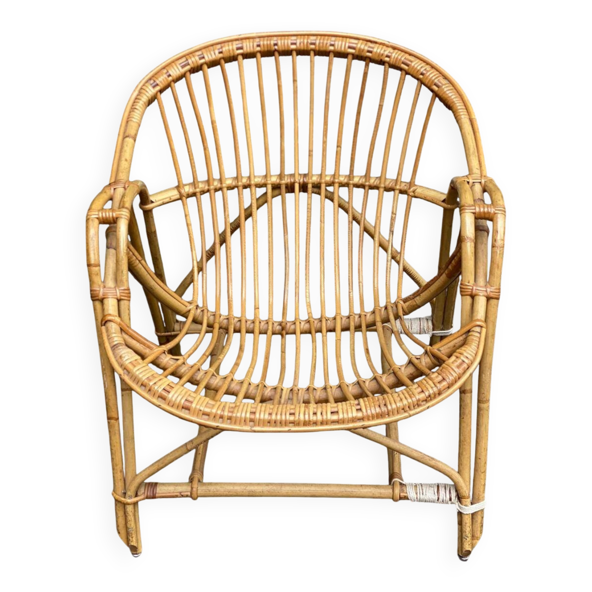 1970s adult rattan and wicker armchair with a round burgundy velvet cushion.