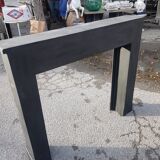 Wooden fireplace and patinated plywood