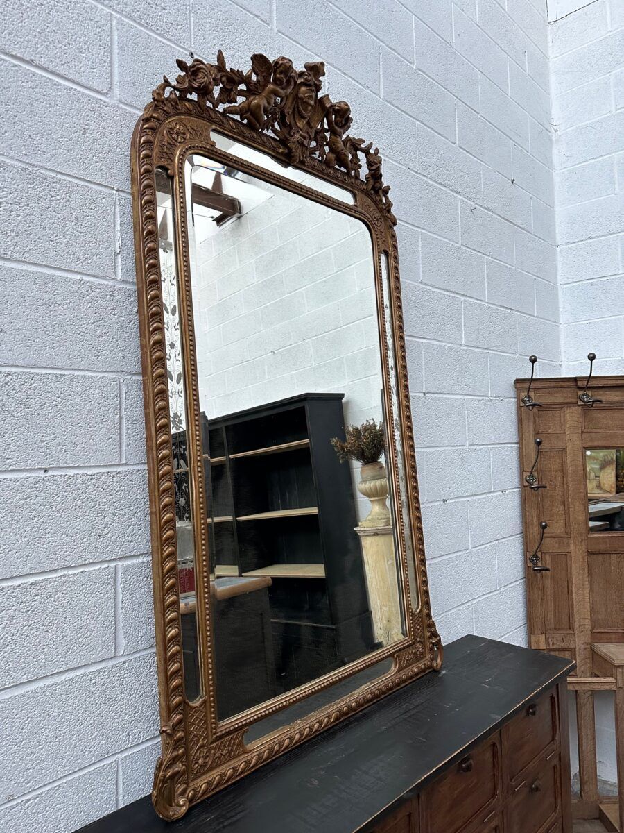 19th-century mirror with cherubs
