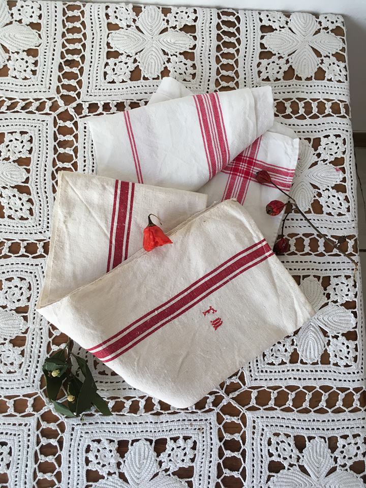 Two mismatched former dishcloths in red and white.