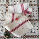 Two mismatched former dishcloths in red and white.