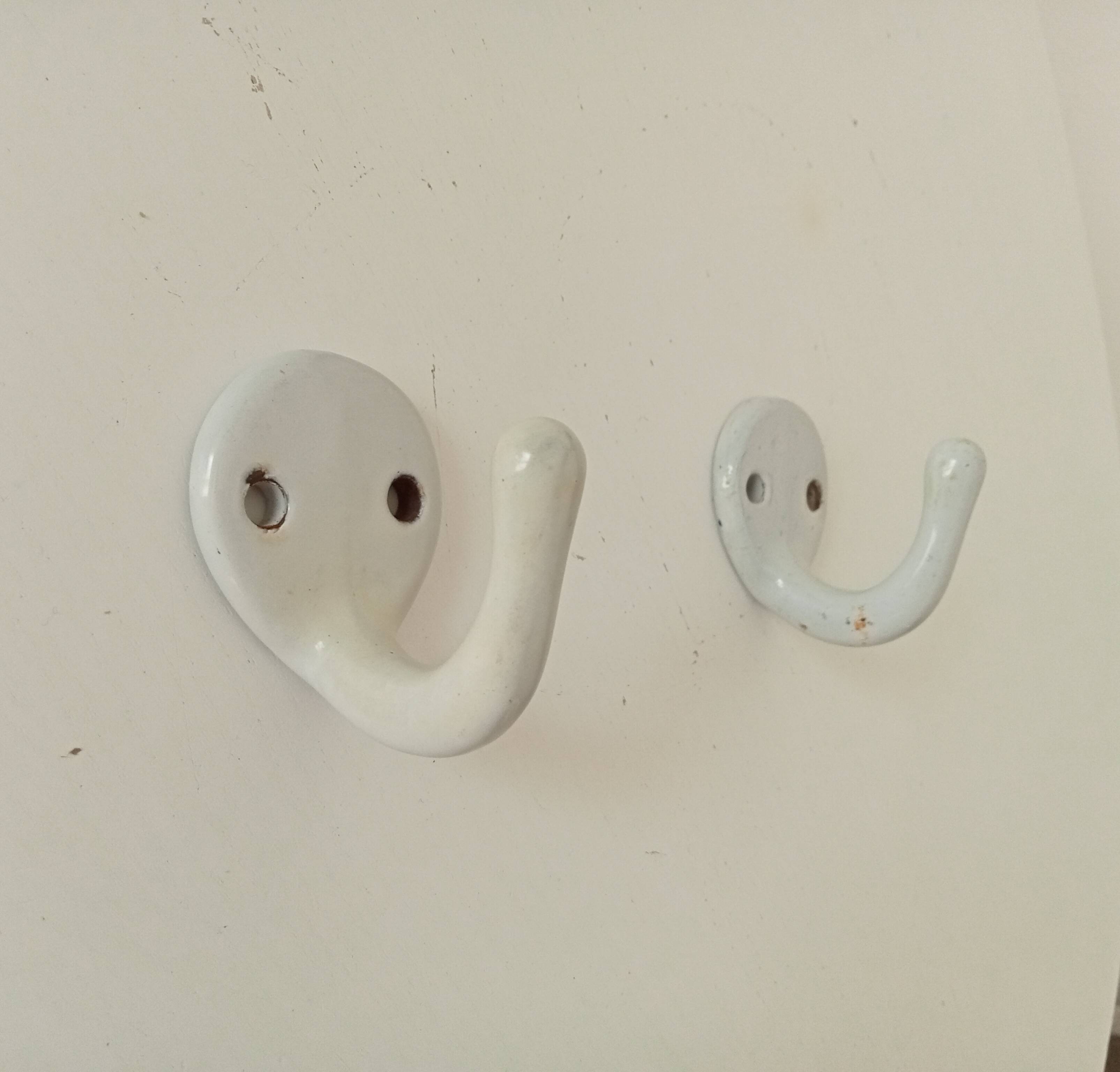 Antique enamelled cast iron wall hook from the 30s/40s