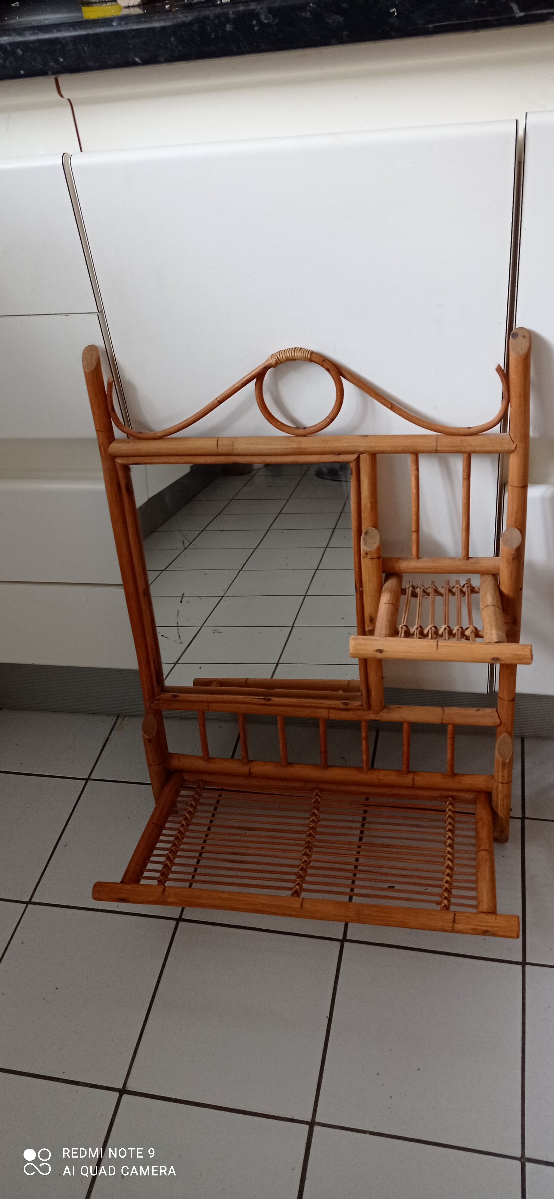 Old bamboo and rattan mirror with vintage folding shelves