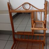 Old bamboo and rattan mirror with vintage folding shelves