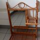 Old bamboo and rattan mirror with vintage folding shelves