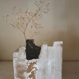 Vase architecture in raw sandstone.