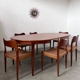Round teak table with Scandinavian design extensions from the 60s vintage