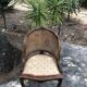 Old wooden armchair and cannage