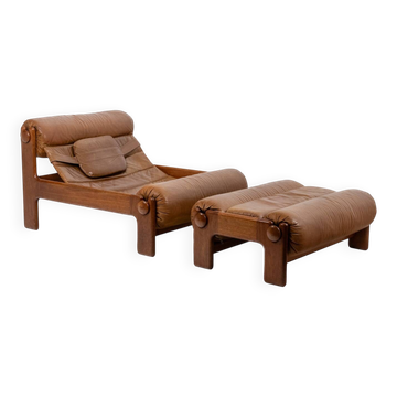 Lounge chair and ottoman, in blond elm and leather. 1970s
