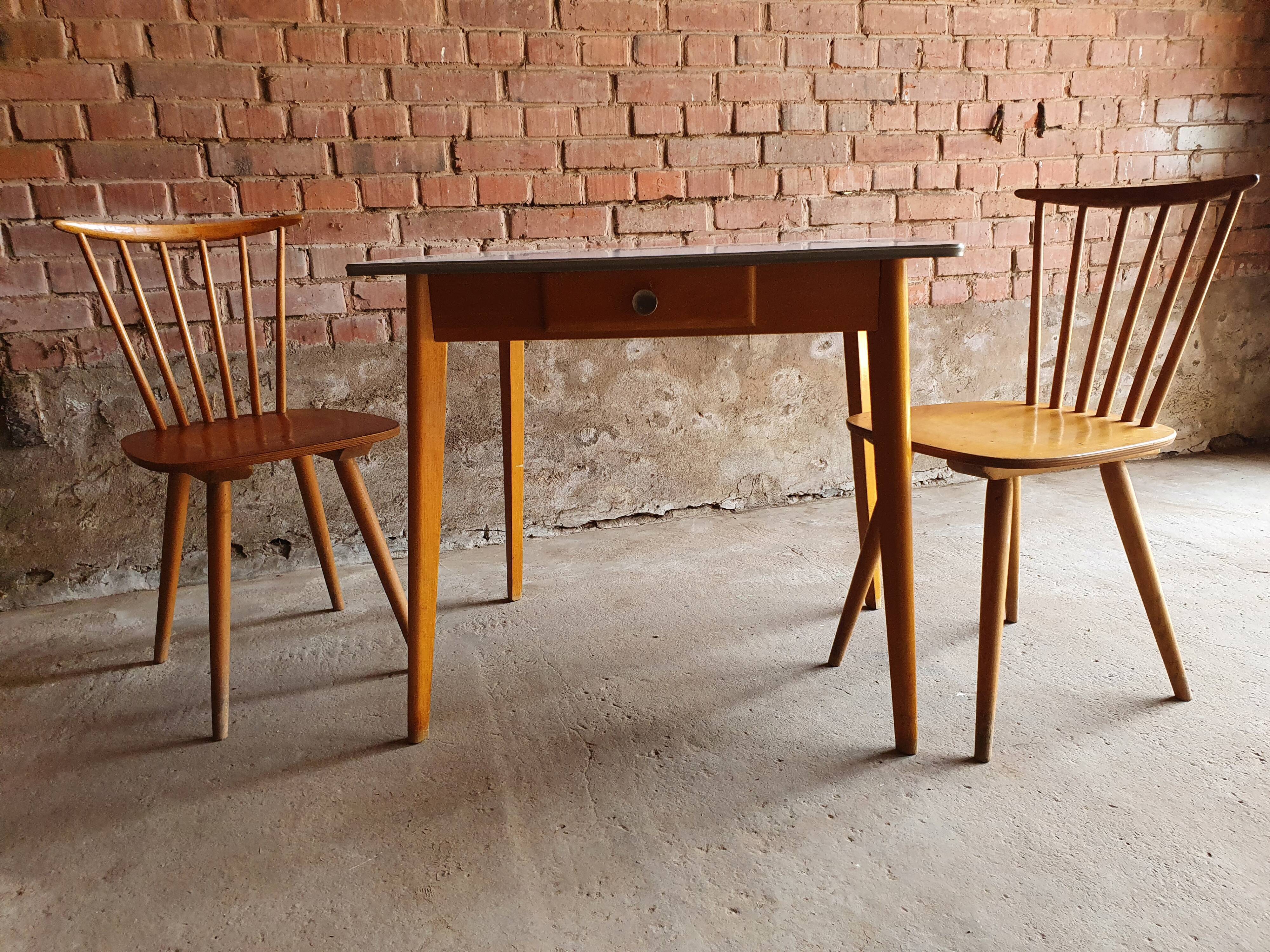 Together two Scandinavian chairs and its wooden and formica table