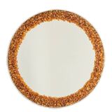 Circular and backlit mirror in amber. Contemporary artist's work.