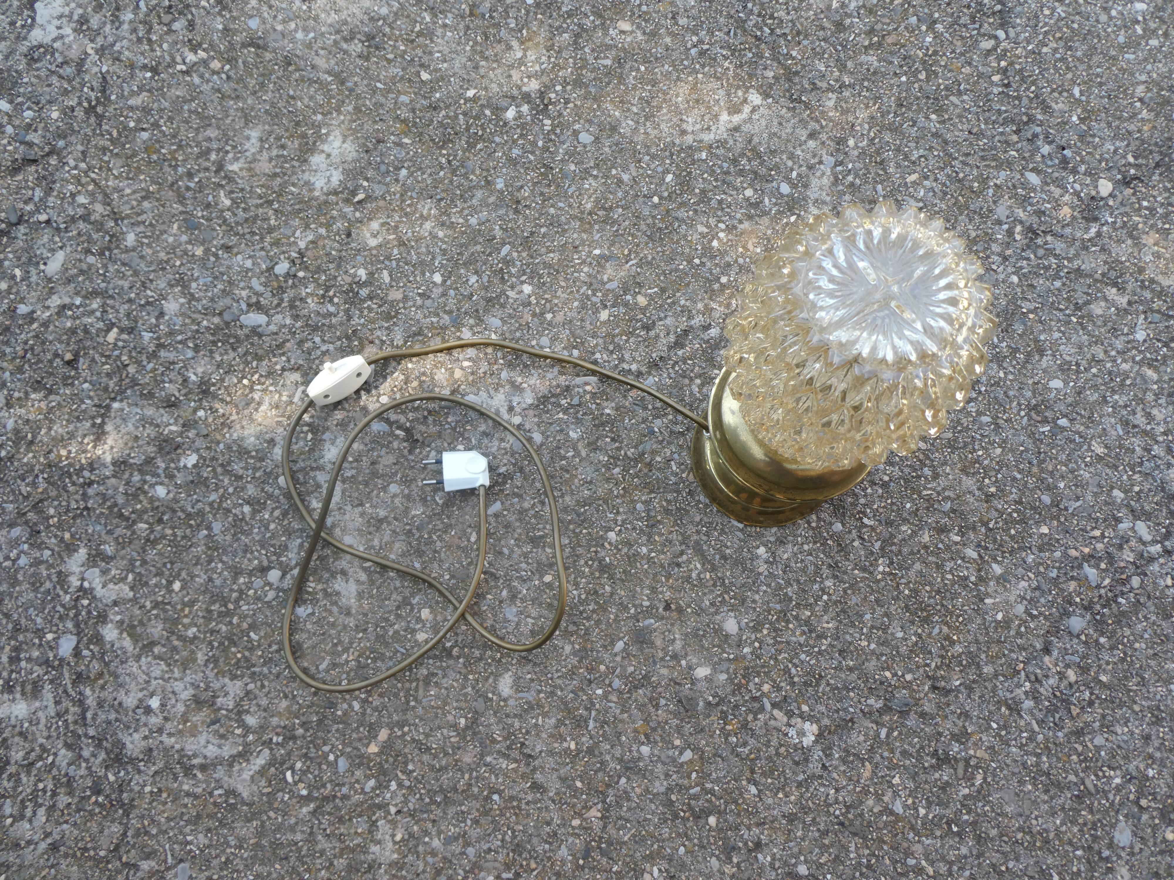 Vintage table lamp with chiseled glass globe.
