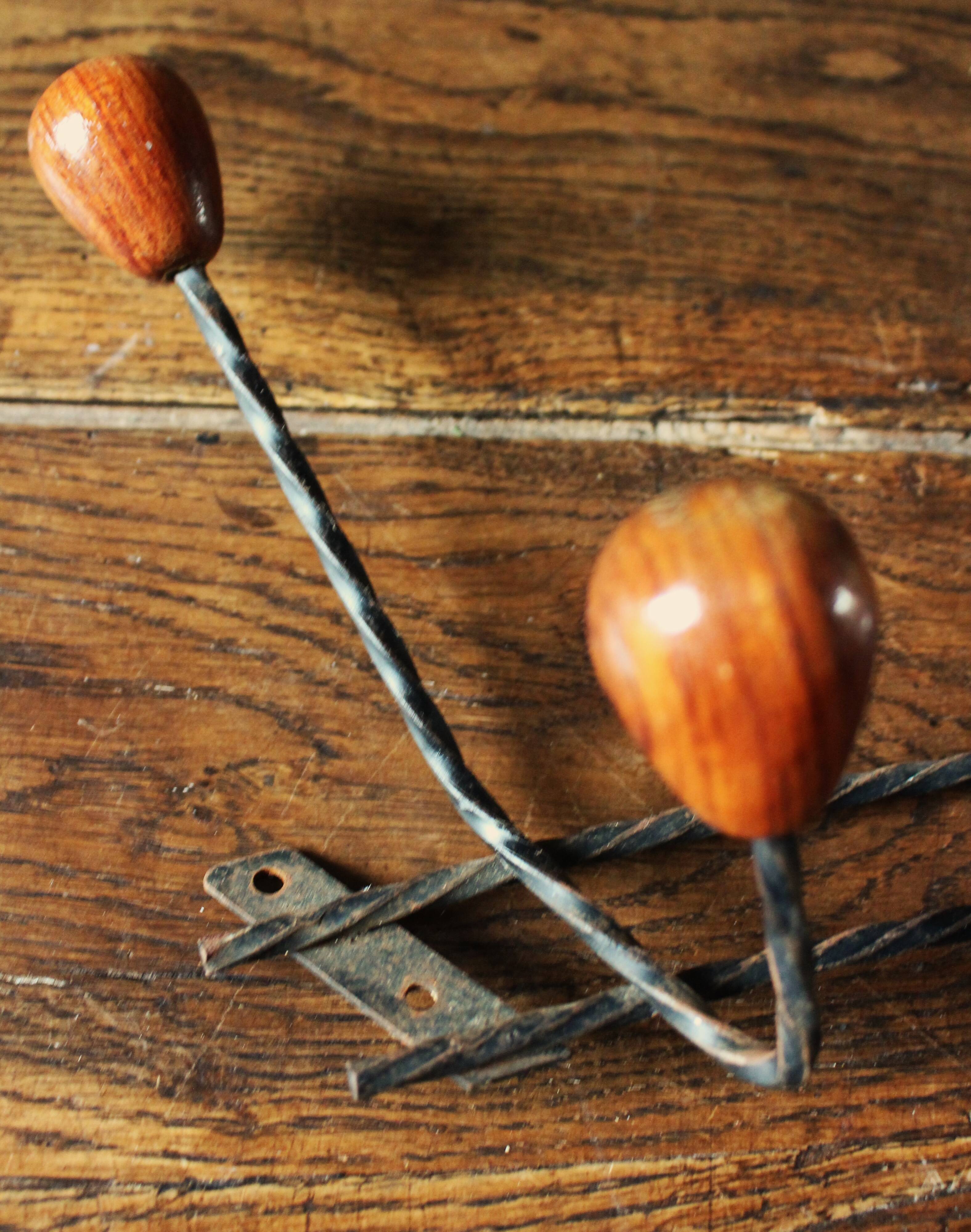 Double wrought iron coat rack with 3 double wooden ball hooks