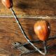 Double wrought iron coat rack with 3 double wooden ball hooks