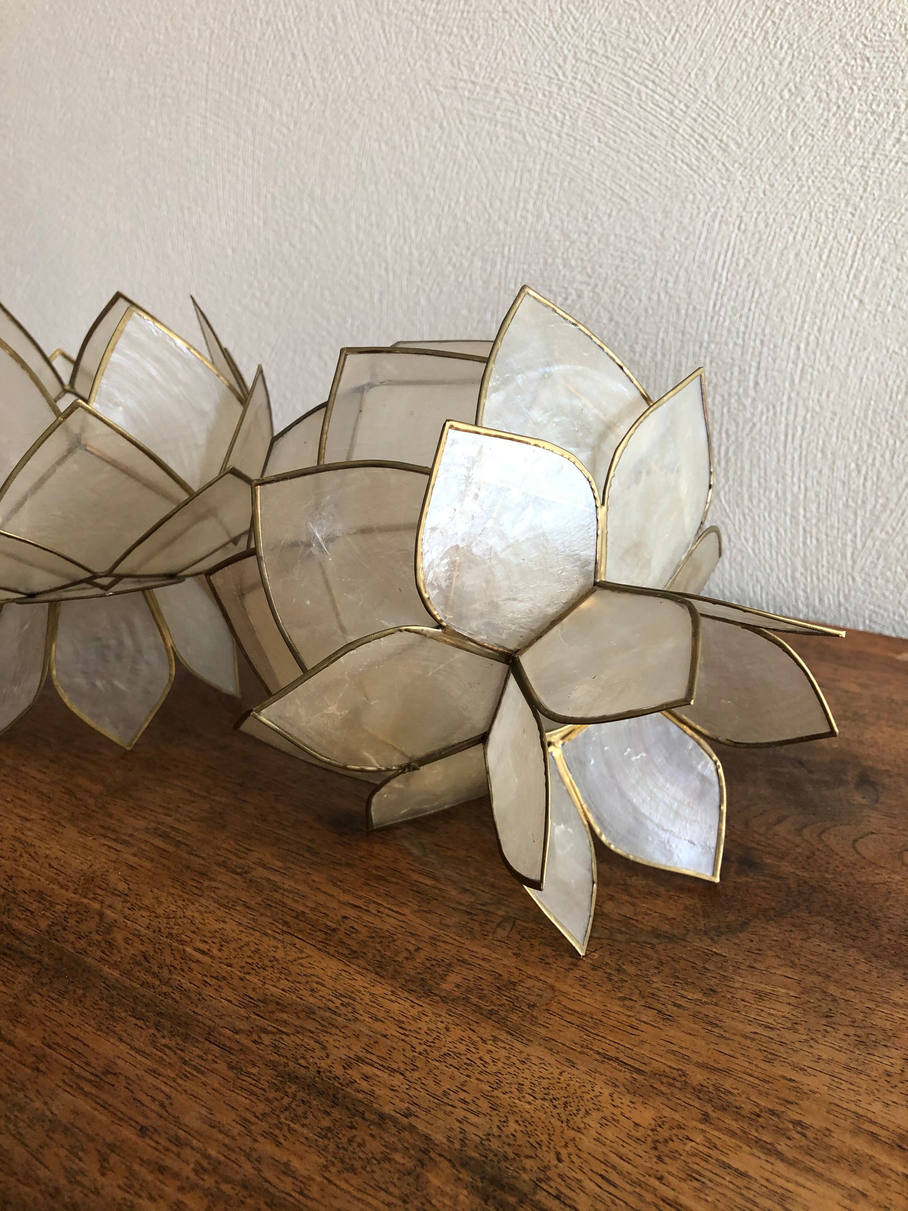 Lotus flowers in mother-of-pearl sconces