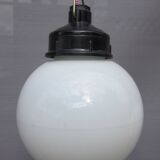 Trio of opal glass and bakelite globe pendant lights