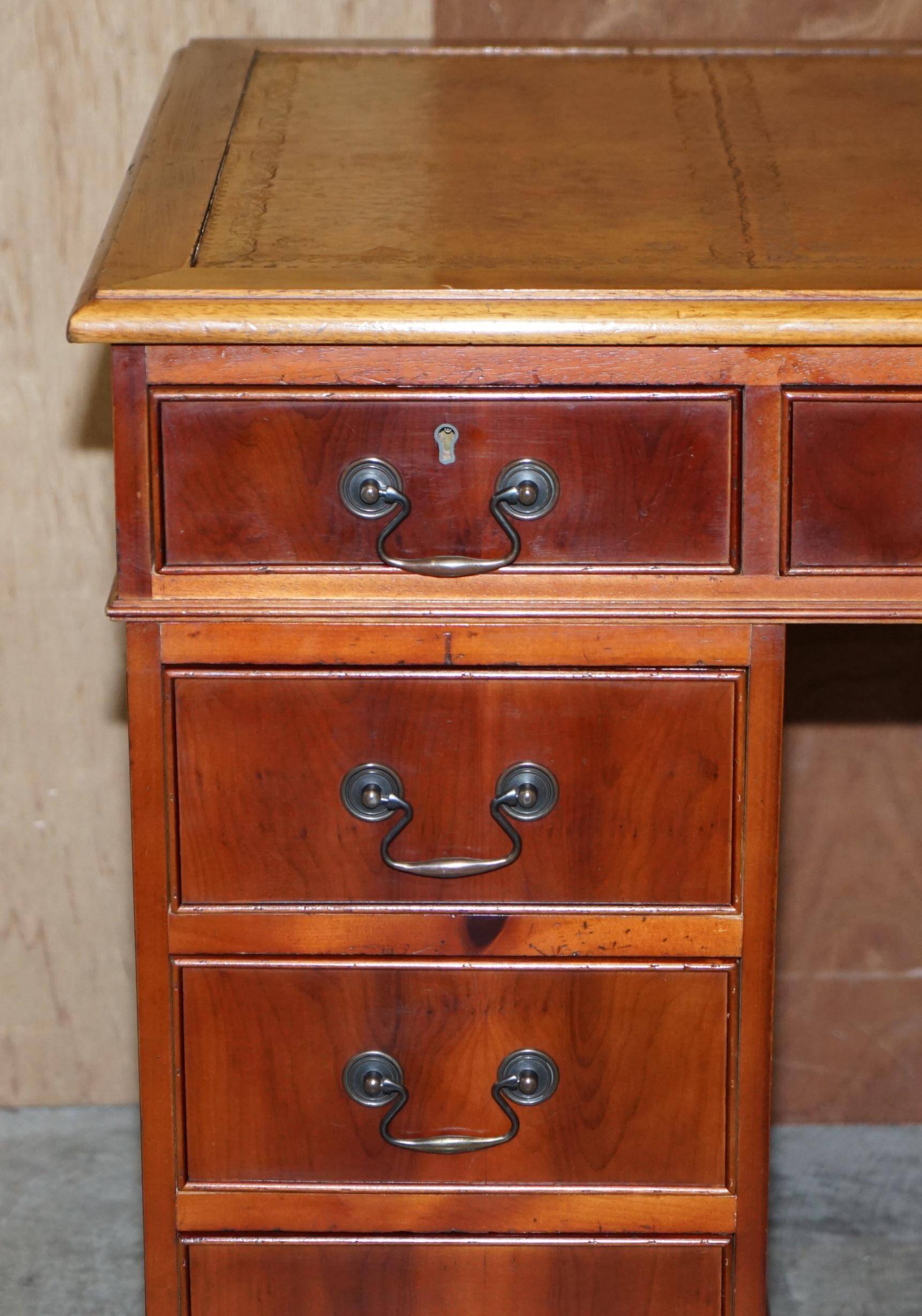 Vintage walnut desk with a leather top and two drawers.