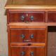 Vintage walnut desk with a leather top and two drawers.