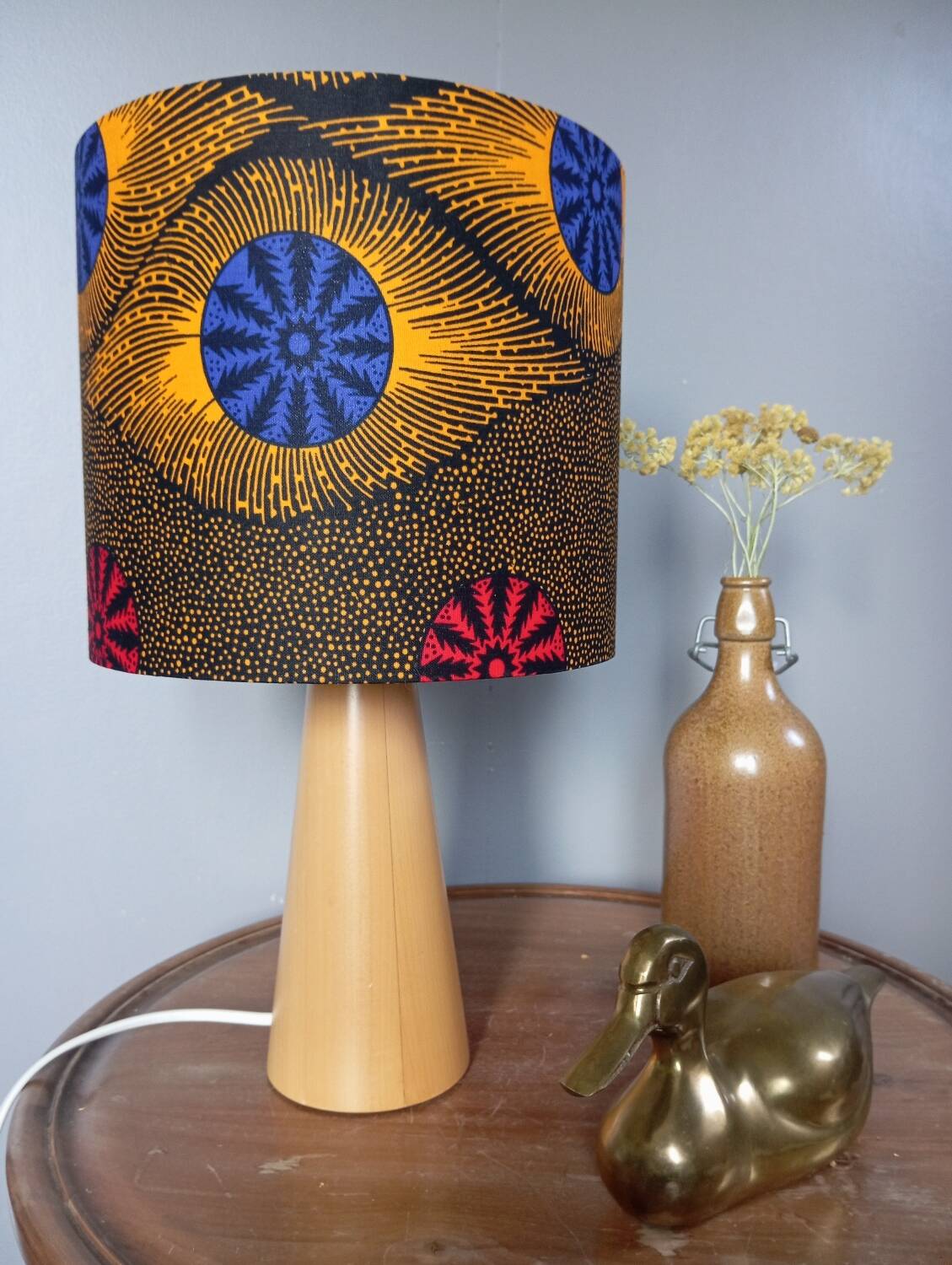 Table lamp in blond wood with handmade wax shade