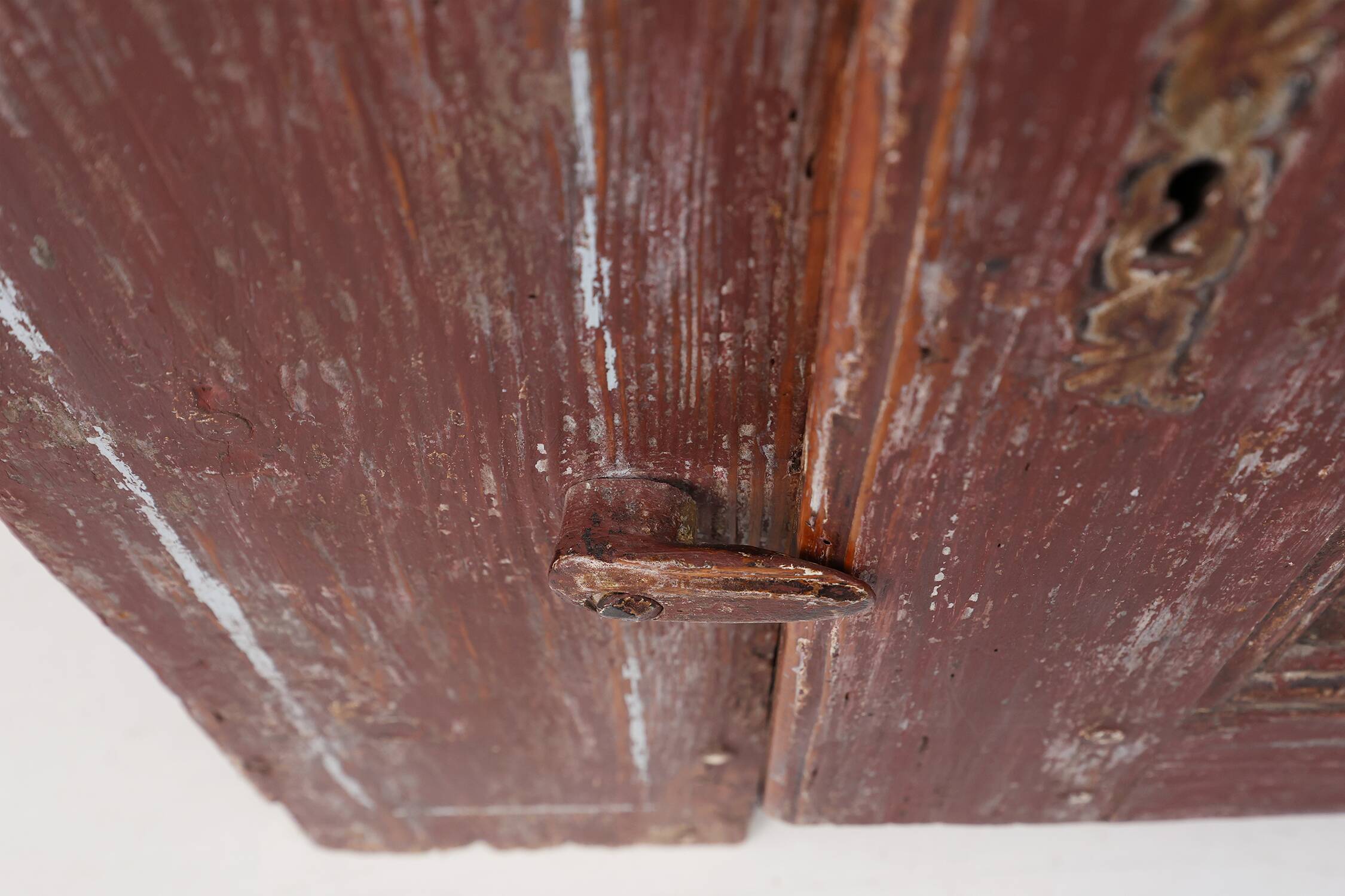 Rustic Parisian cabinet in pine wood with old burgundy paint layers, ca. 18