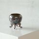Neoclassical cup with a patinated and silvered copper base.