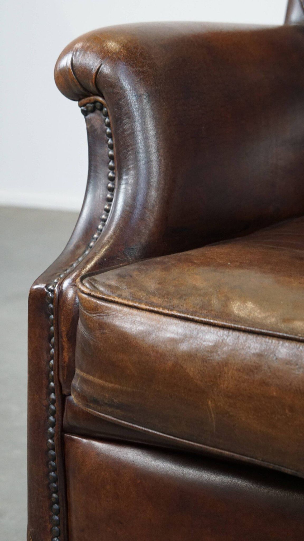 Vintage sheepskin armchair in a dark cognac colour with a comfortable seat
