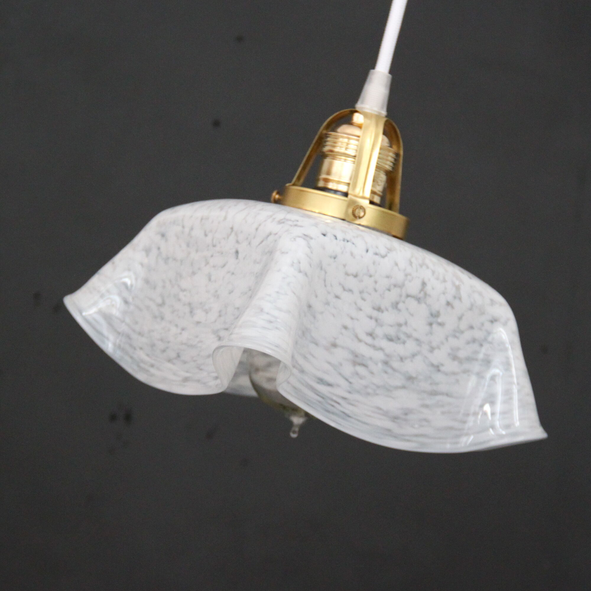 Hanging lamp draped in glass
