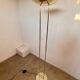 Old golden brass floor lamp with Italian design bulb from the 70s vintage
