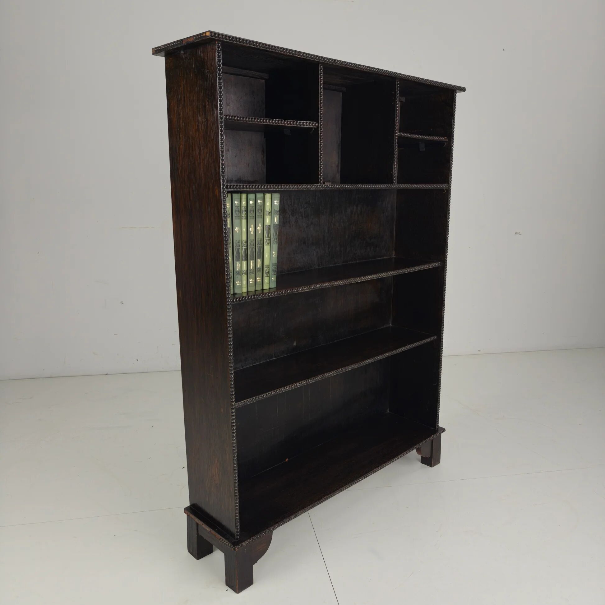 20th century open bookcase with bead motif