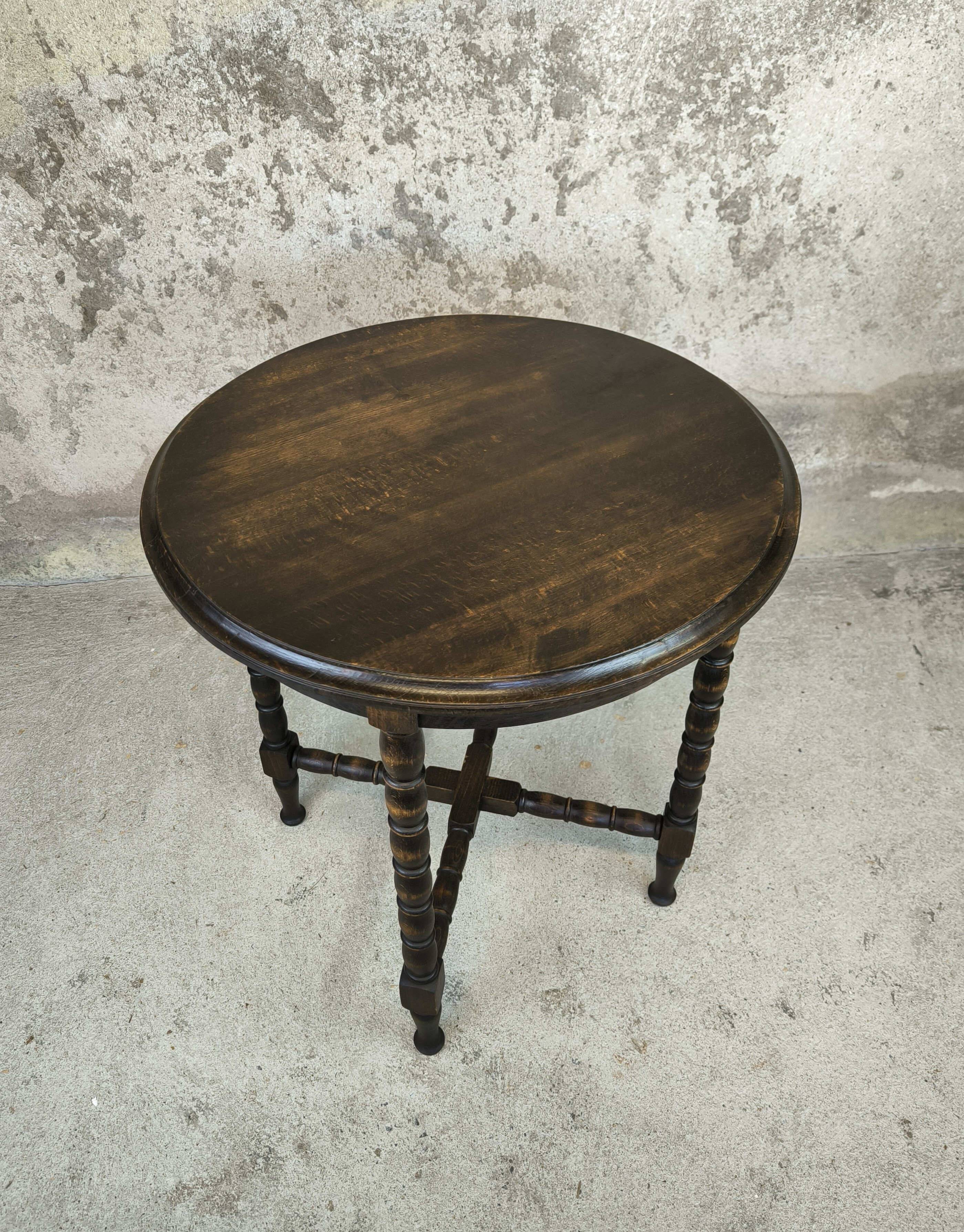 Vintage gueridon with beaded wooden legs.