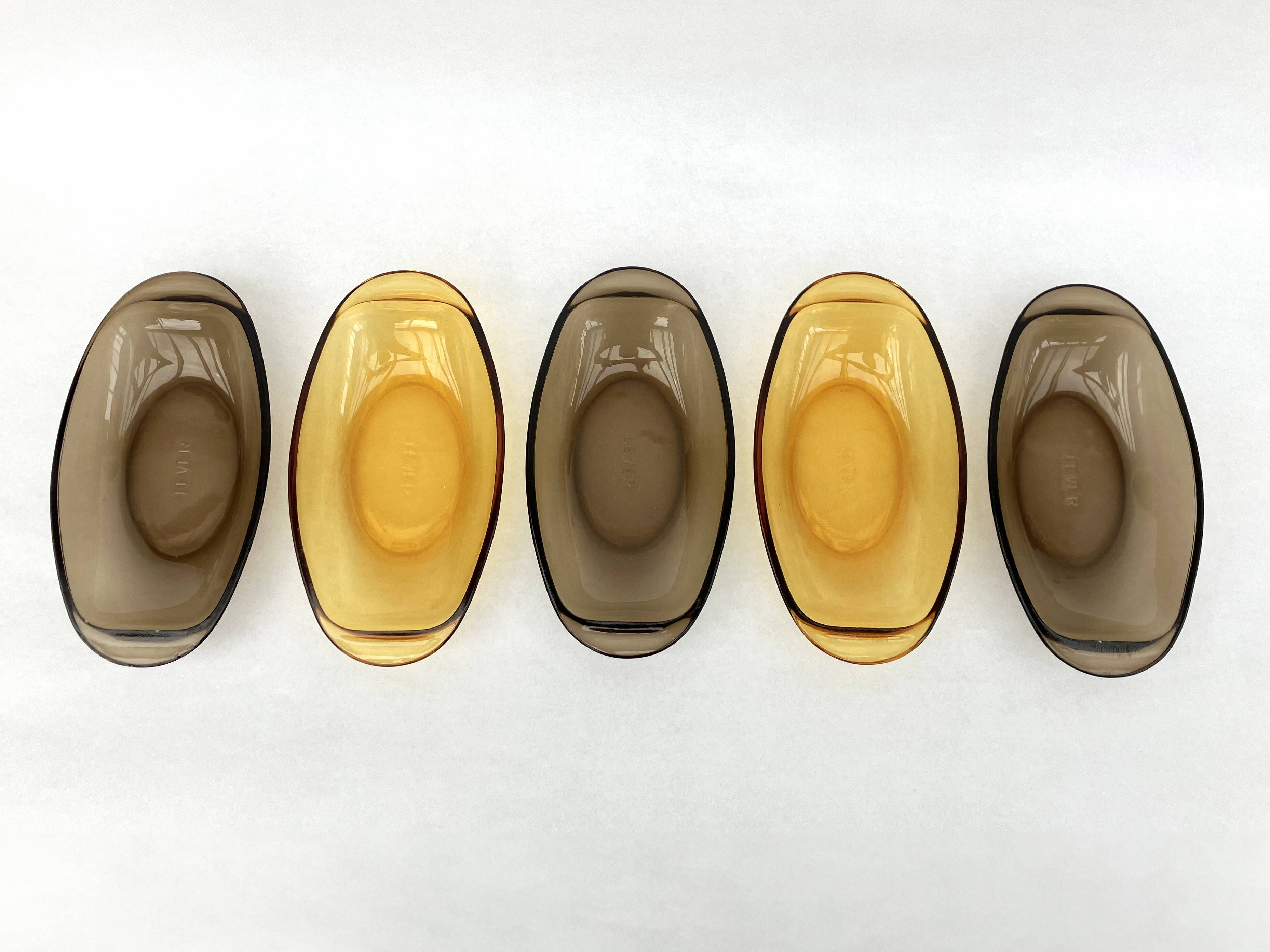 Set of 5 small oval eared dishes in amber and smoked tempered glass