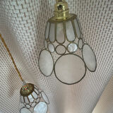 Pair of portable lamps with mother-of-pearl lampshades and brass.
