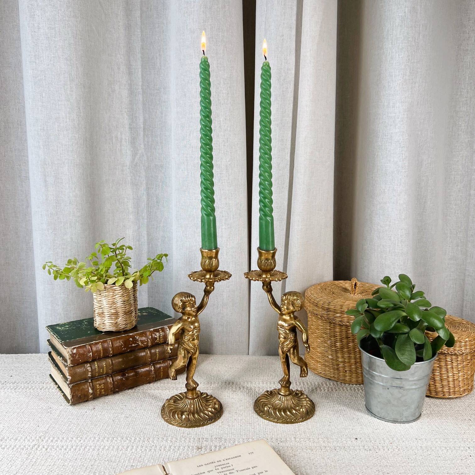 Pair of bronze “Cherubim” candlesticks