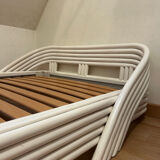 Vintage white rattan bed from the 1960s.