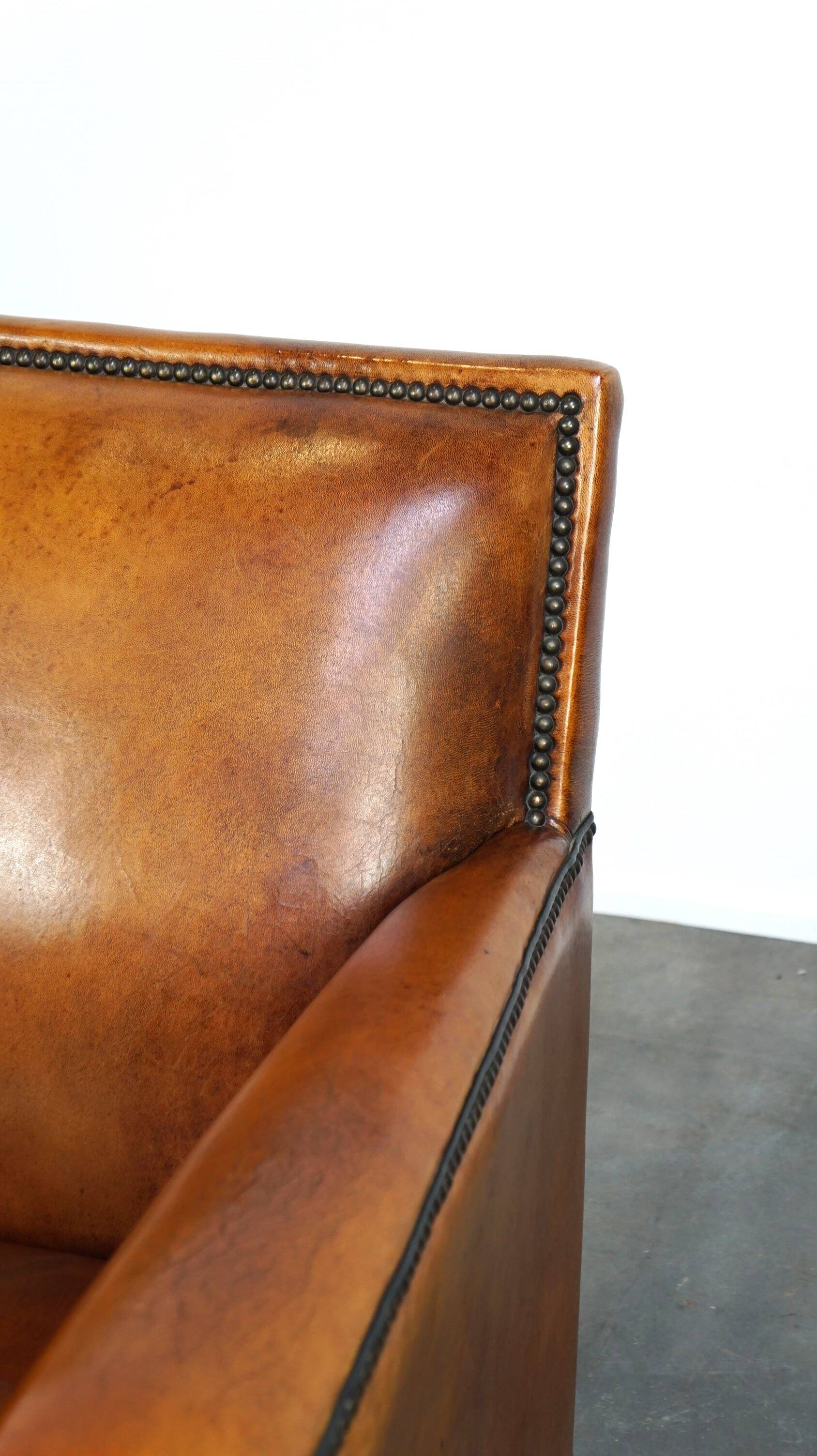 Sleek sheepskin Art Deco design armchair with beautiful details