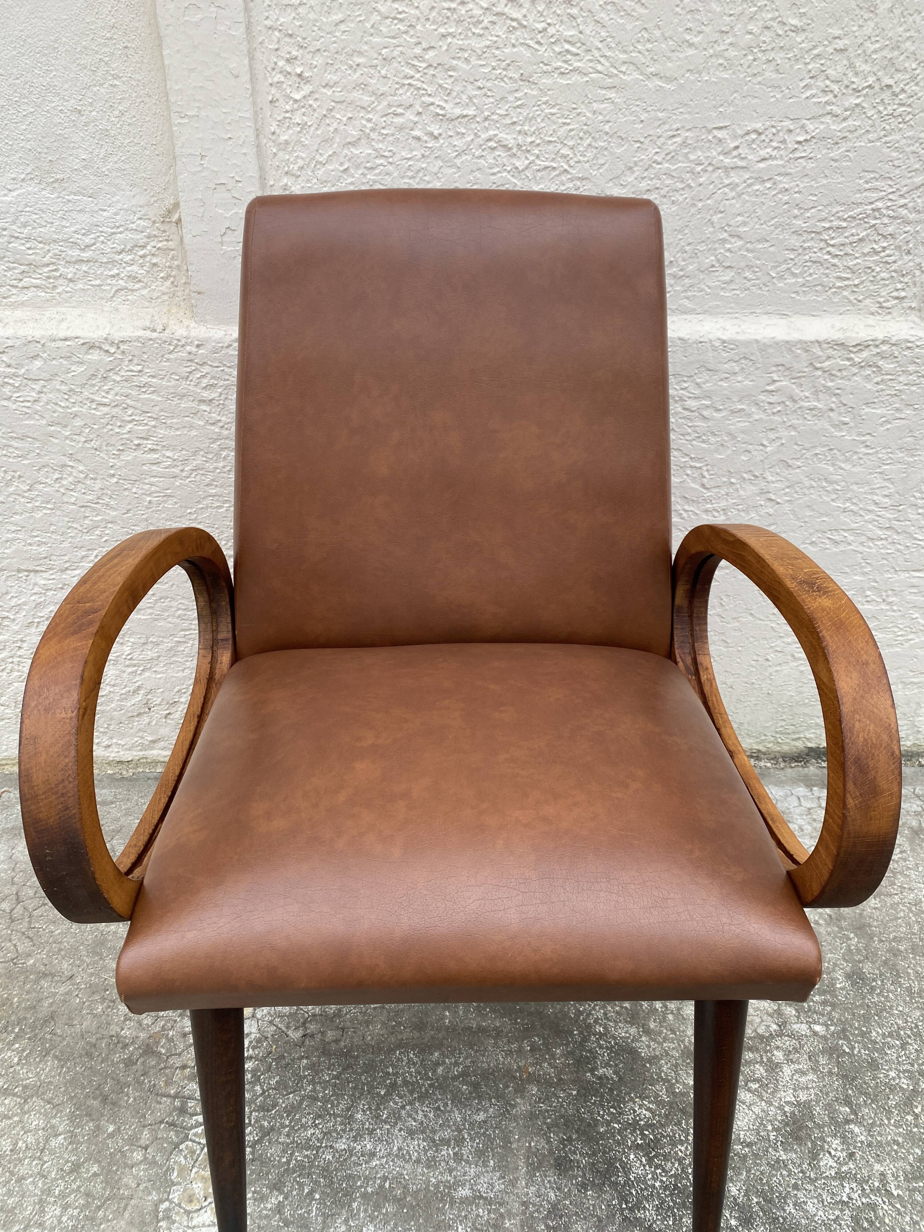 Mid-Century Scandinavian vintage retro armchair with oval armrests.
