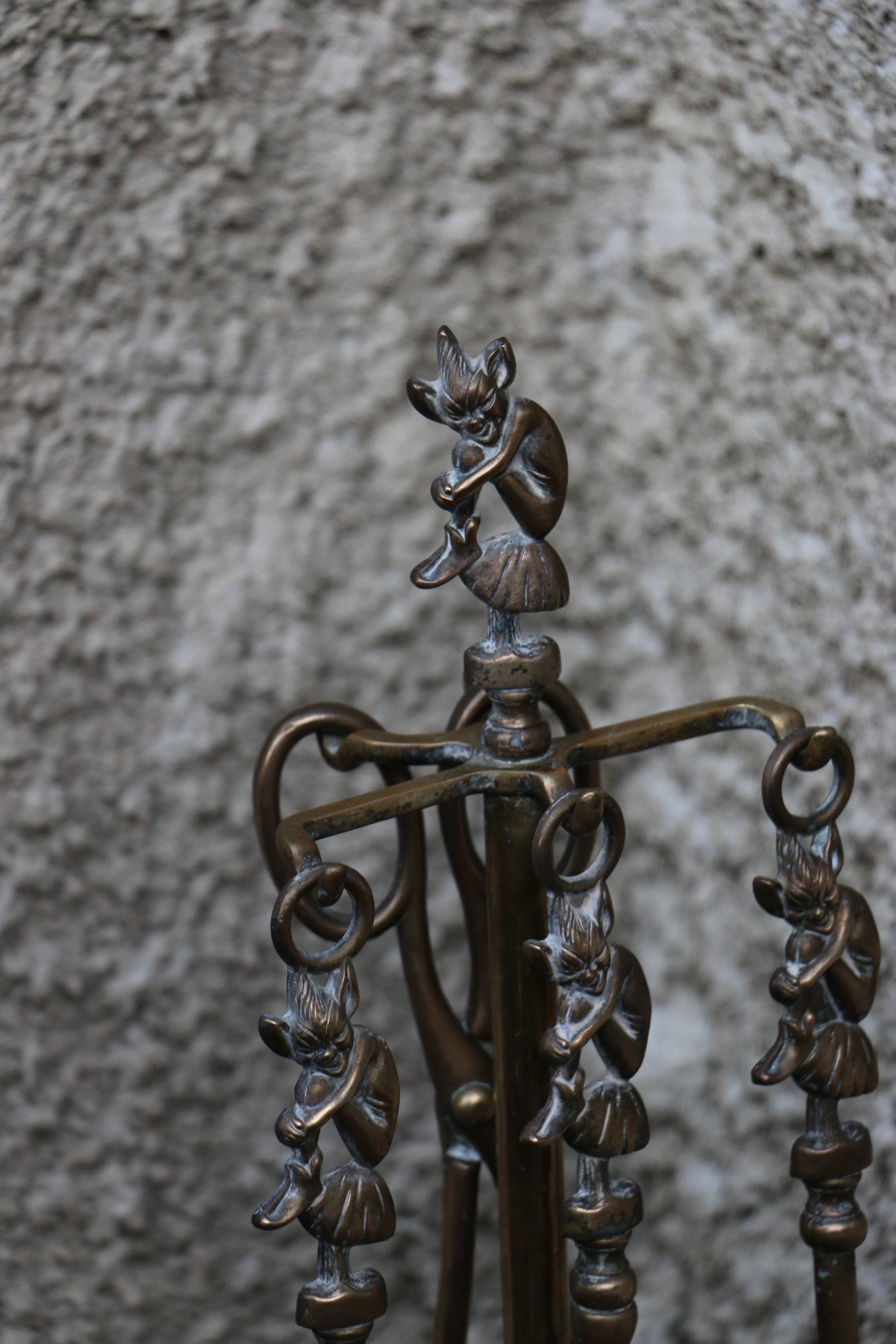 Brass fireplace servant with pair of cast iron pegs with vintage brass ball year 60