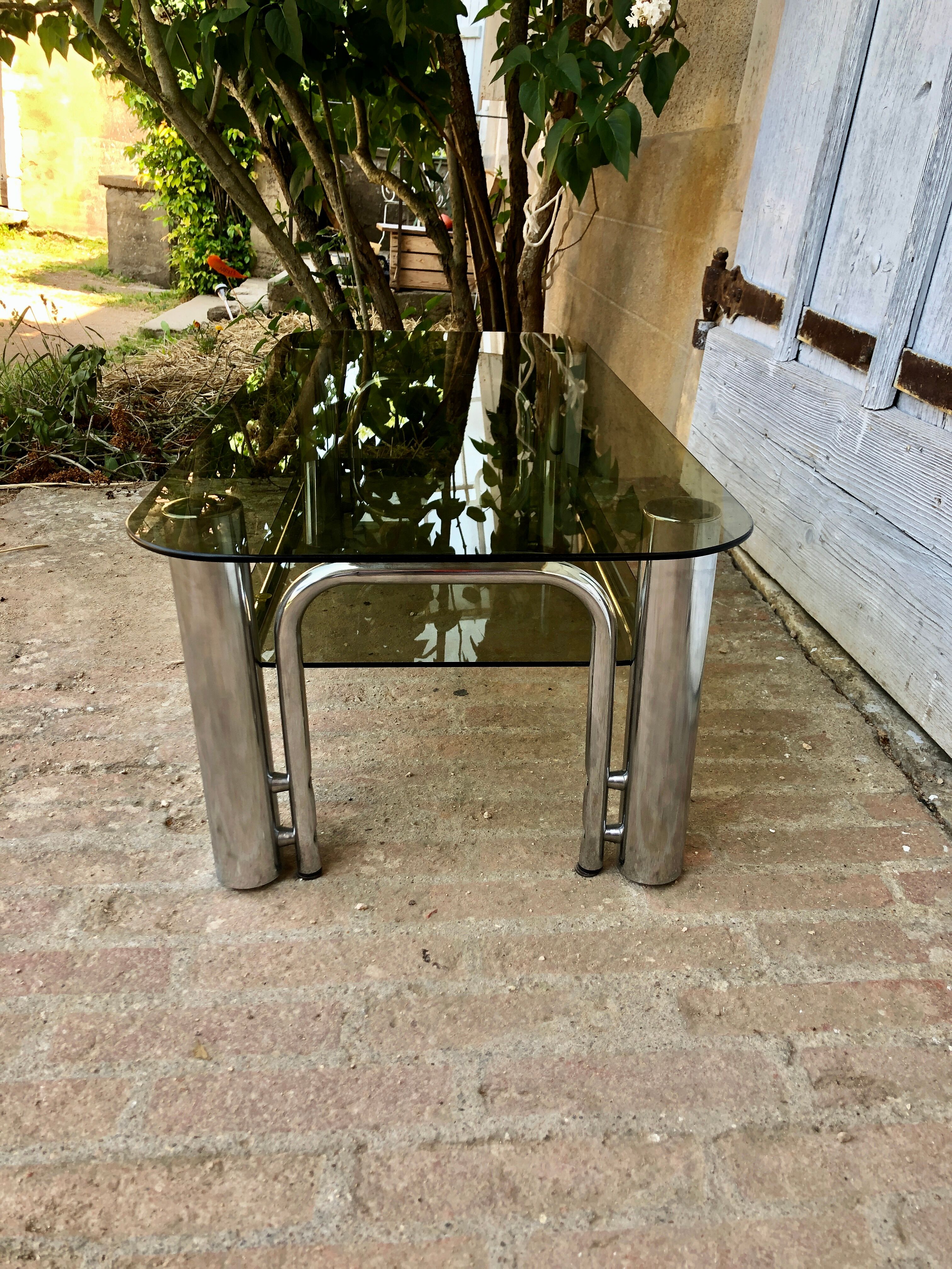 Coffee table chrome tubes and smoked glasses 1970