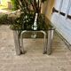 Table basse tubes chrome et verres fumés 1970