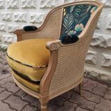 Cane and velvet armchair