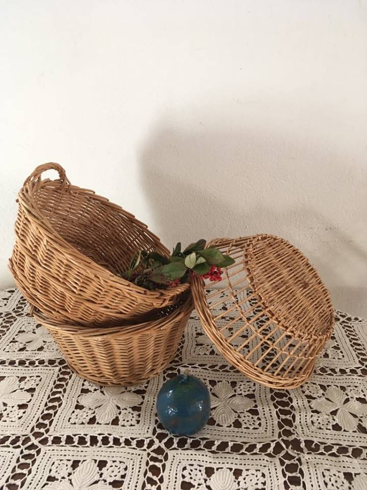 Three natural wicker baskets