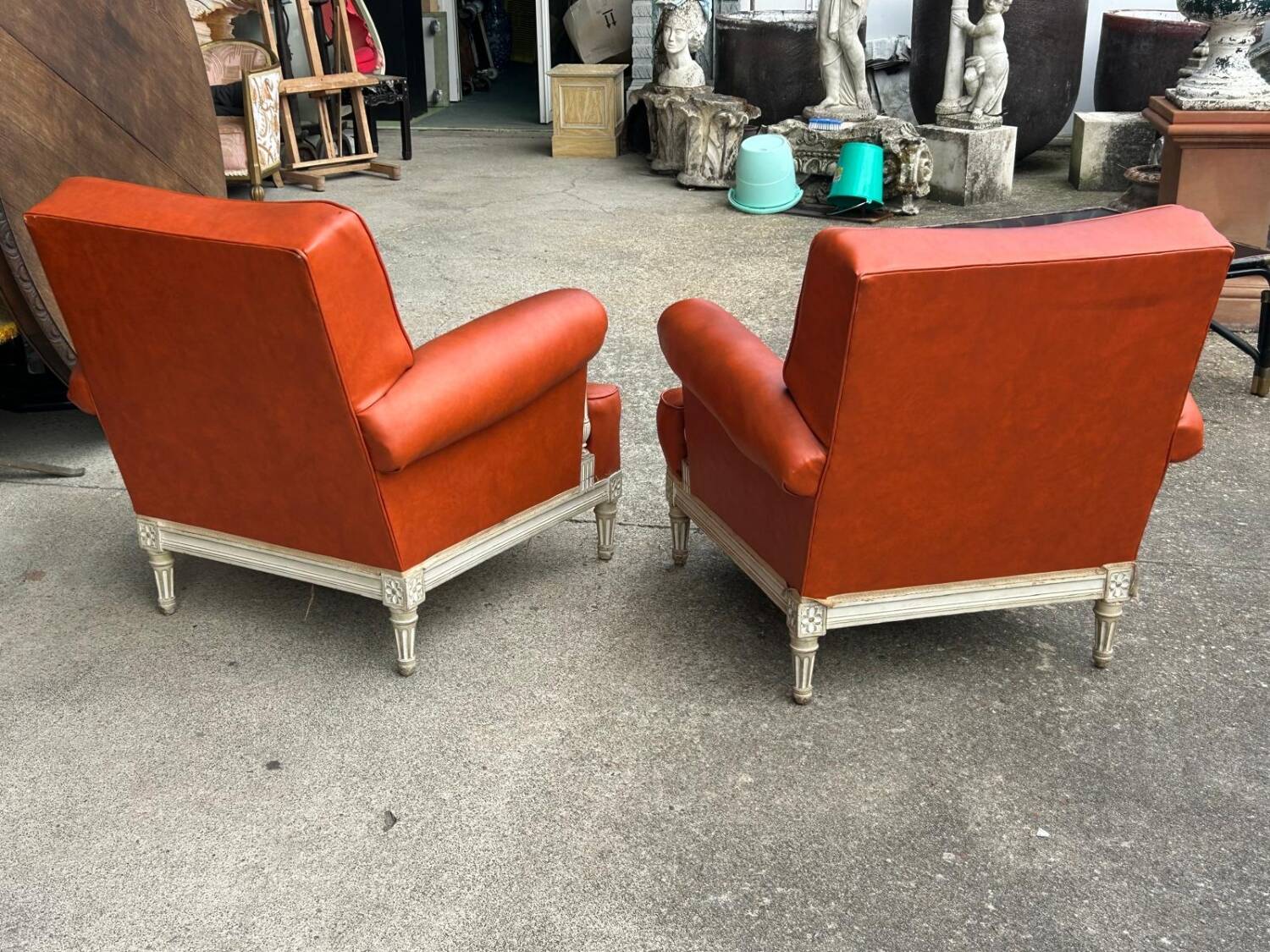 Pair of neoclassical bergère armchairs by Maison Jansen circa 1950.