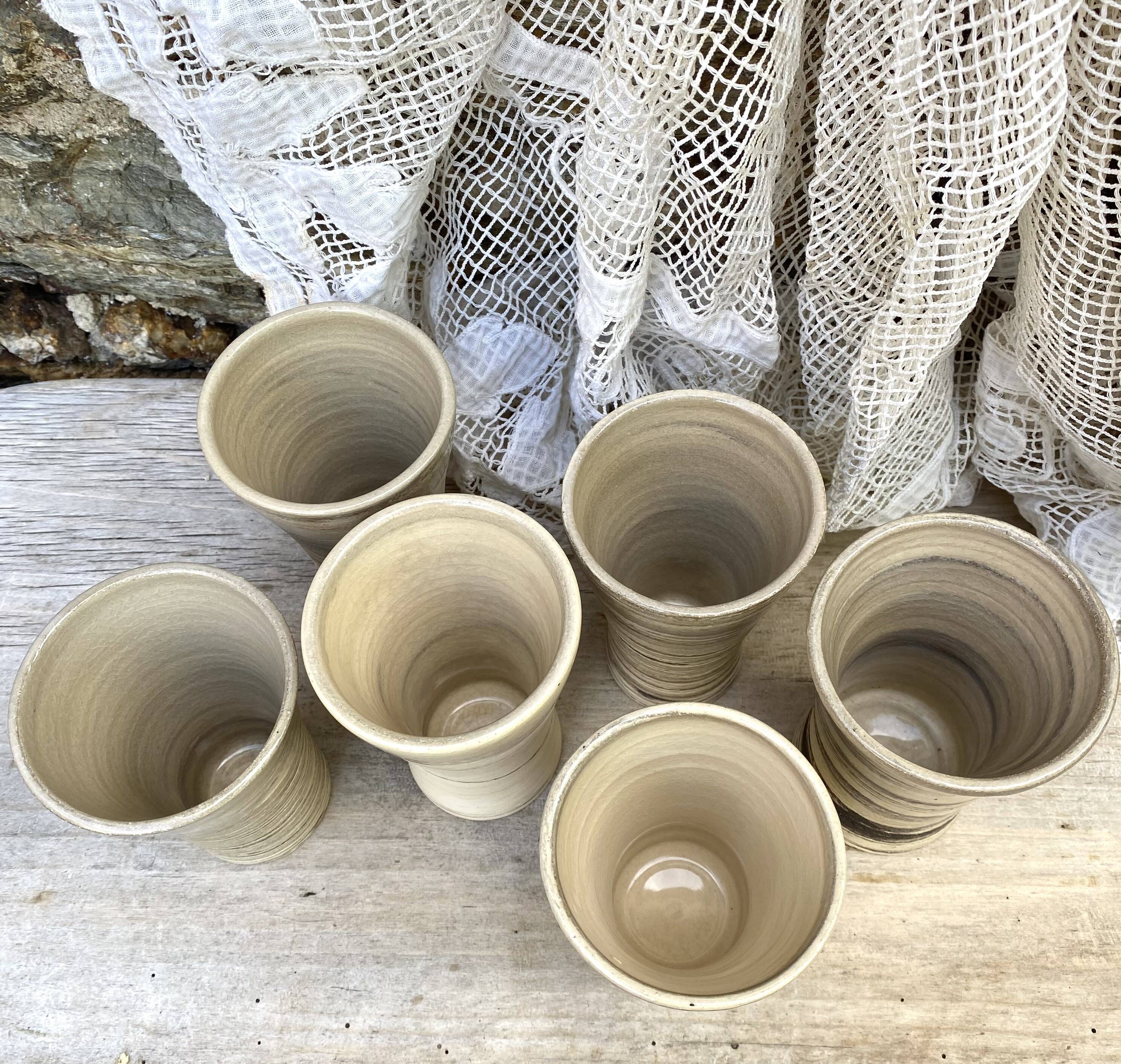 High ceramic cups made of mixed clay.