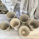 High ceramic cups made of mixed clay.