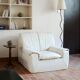 Cinna armchair in cream leather, bolstered armrests, 1970s.