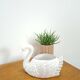 vintage porcelain flower pot in the shape of a swan