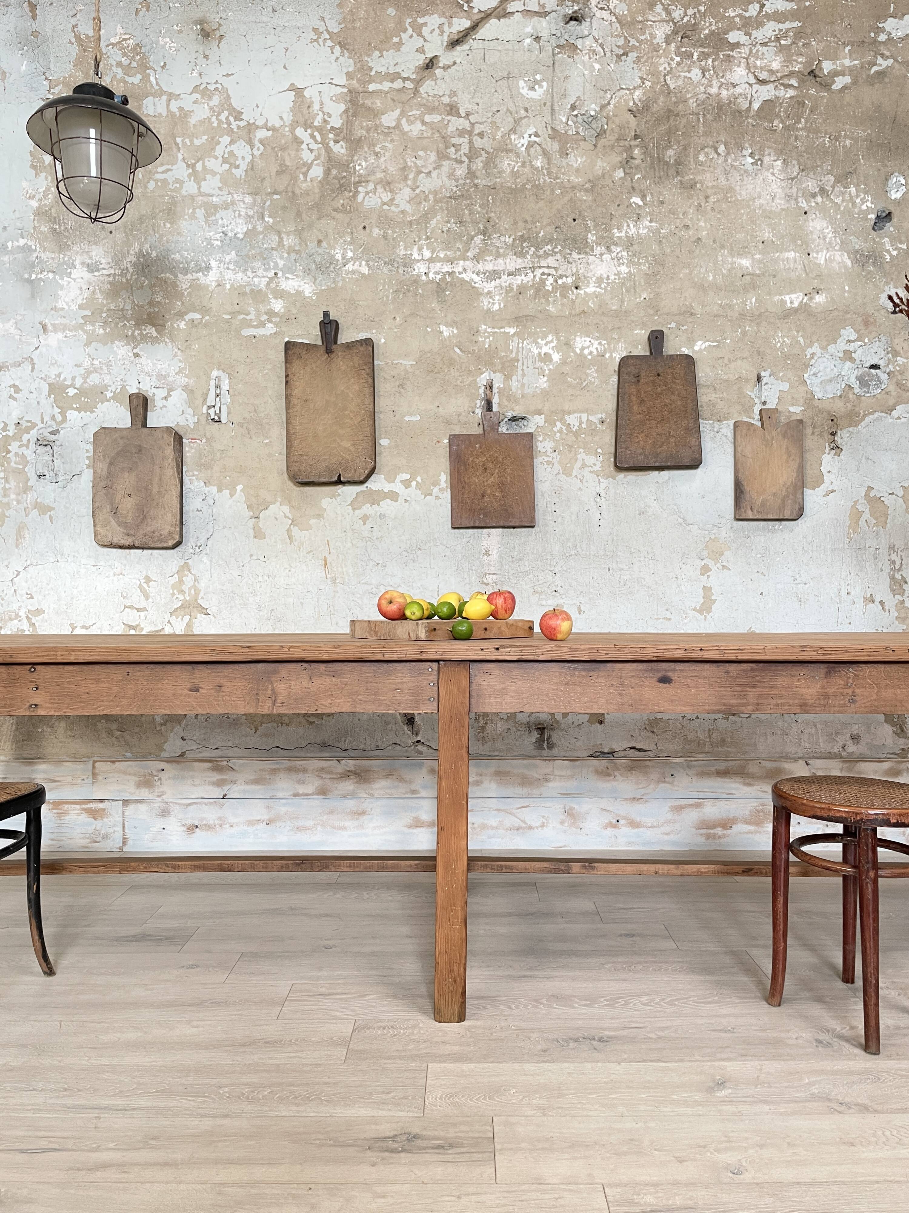 Solid wood workshop table with straight legs.