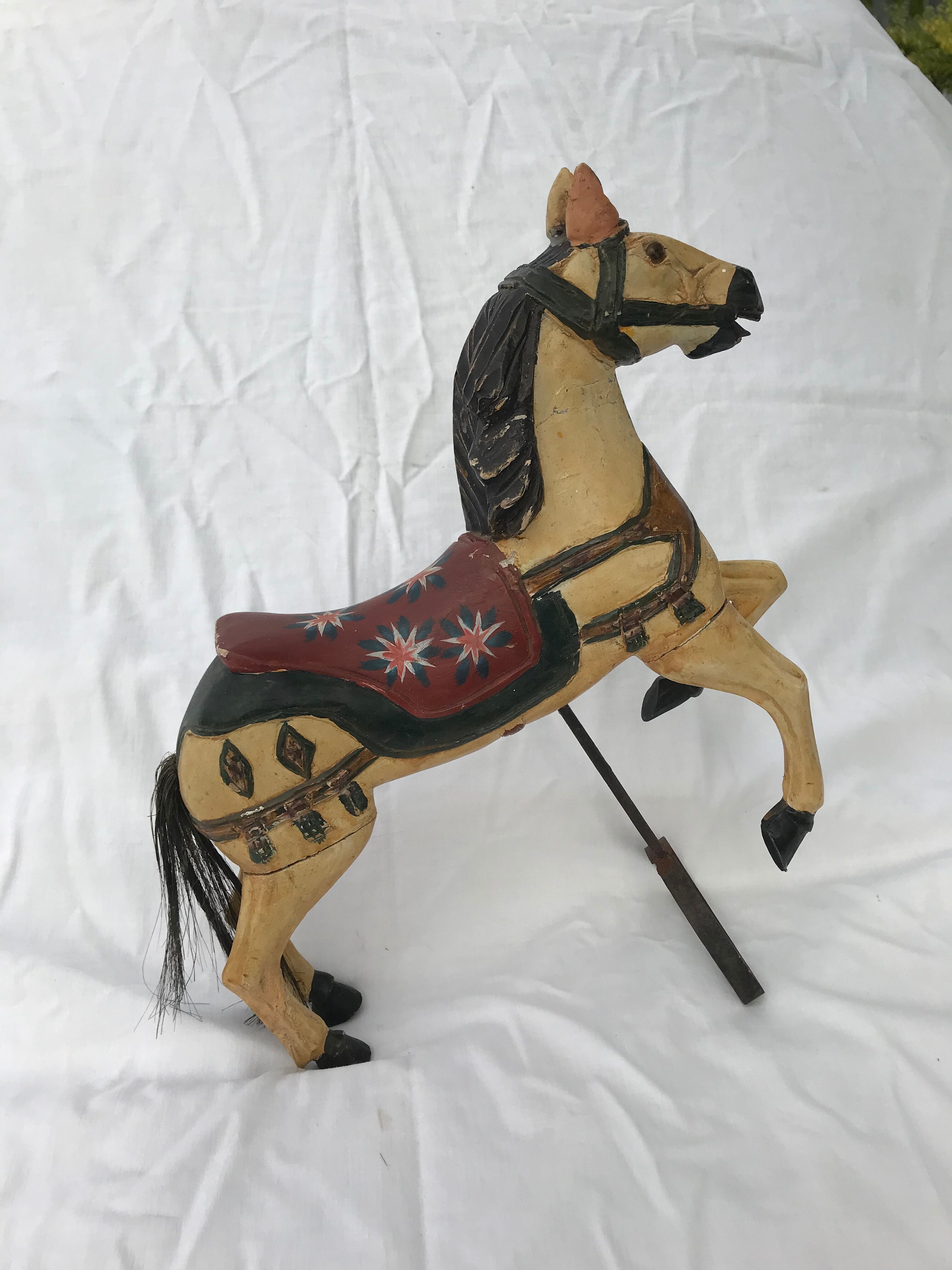 Wooden horse with period ironwork support
